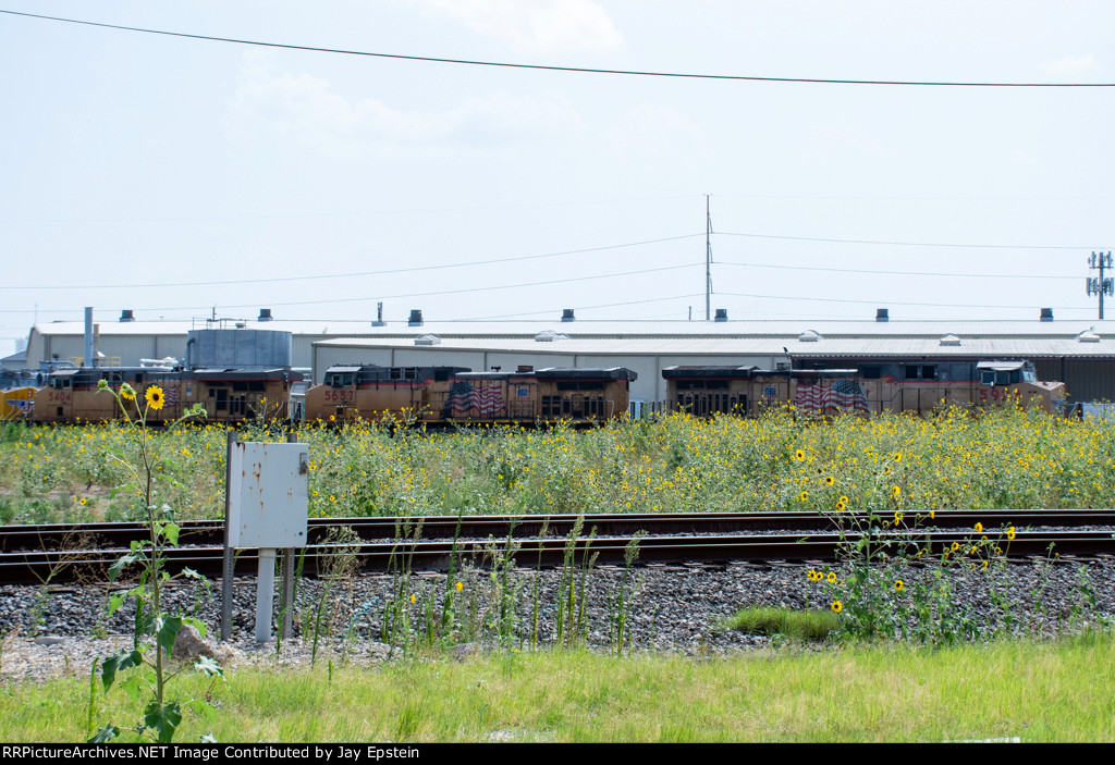 A train swings onto the Houston West Belt Sub at Tower 26 